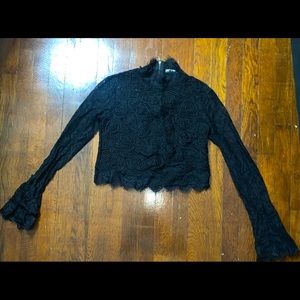 Black laced long sleeve top. Mock neck.